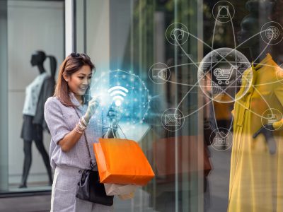 Asian woman using the smart mobile phone for check online shopping order is completed